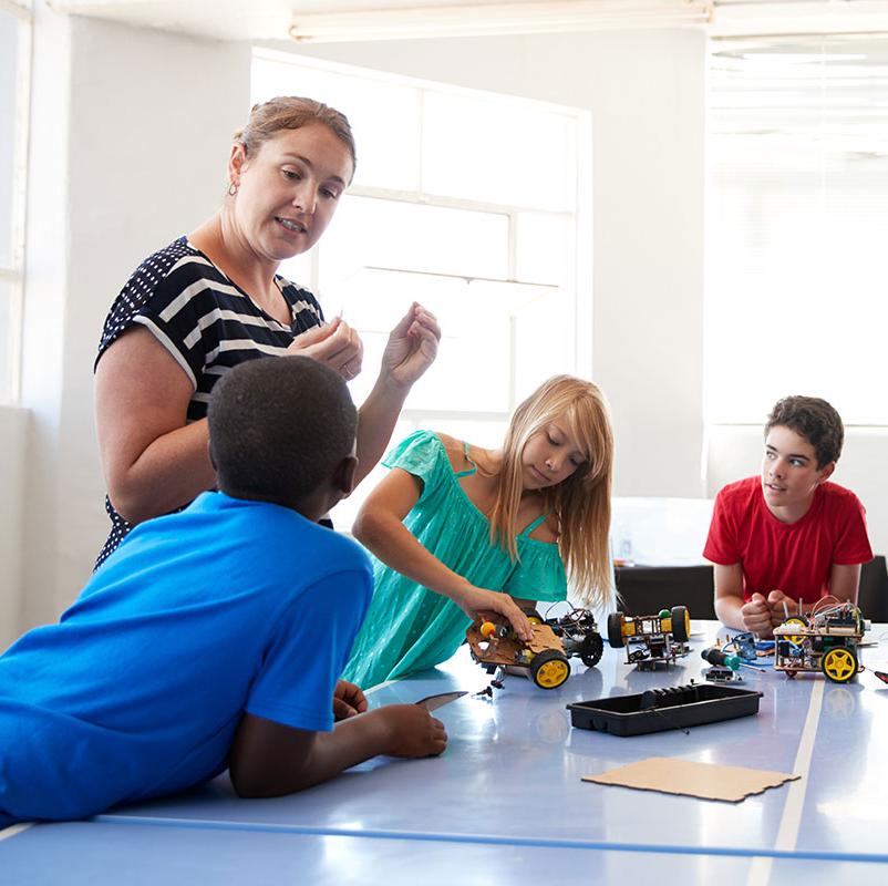 Teacher instructing STEM students.