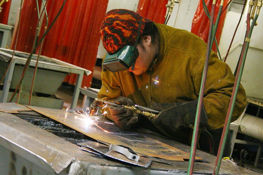 A San Juan College student practicing welding